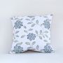 Cotton cushion with blue floral embroidered pattern displayed on a white background highlighting detailed stitching and soft textured fabric for decor styling.