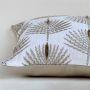Closeup view of cream cushion with detailed leaf embroidery capturing raised stitching natural texture and premium soft fabric perfect for modern decor.