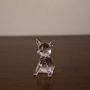 Transparent glass dog sculpture with pastel pink legs and ears ideal for modern tabletop home decor.