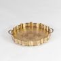 A gold decorative serving tray with carved edges and matching bowls displayed on a clean white background highlighting its elegant detailing and polished metallic finish.