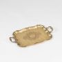 Golden decorative serving tray with ornate handles and engraved detailing displayed on a clean white background.