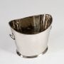Silver champagne ice bucket on a clean white background showing its reflective finish and engraved detailing with a minimal and bright presentation.