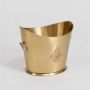 A gold champagne bucket on a white background showing its smooth surface engraved emblem and handle design with a clean bright studio look white background.