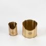 Set of two gold pencil holders shown on a white background with smooth metallic finish and scalloped edges highlighting their decorative desk organizer design.