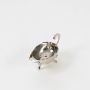 An overhead view of the empty silver plated gravy boat with scalloped rim and lion paw feet against a plain white background.
