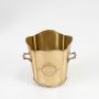 Classic gold brass ice bucket with scalloped edges and engraved elephant logo standing empty against a clean white background.