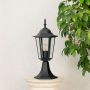 Classic black pillar lamp placed on stone pillar with light off enhancing outdoor entrance and elegant home garden ambiance.