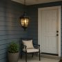 Decorative hanging lantern installed in a cozy courtyard enhancing outdoor ambiance with soft warm glow ideal for porches gardens and patios.