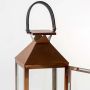 Closeup of copper lantern frame and sleek glass detailing showing high-quality craftsmanship.