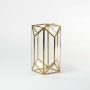 Gold metal and glass geometric candle lantern shown on a white background with candle on highlighting its reflective finish and modern decorative style.