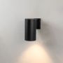 Black metal cylindrical outdoor wall light glowing softly on white background for modern exterior home lighting decor.