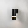 Black cylindrical wall light glowing on white background highlighting dual frosted bands and matte finish.