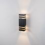 Sleek black wall light on white background featuring ribbed detailing and clear acrylic light bands.