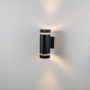 Cylindrical Dual Outdoor Wall Light - Black Light On White BackgroundBlack cylindrical wall light glowing on white background highlighting elegant matte finish and ambient warm illumination.