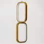 Closeup of gold and white metal dual frame hanging light showing smooth finish and premium modern wall decor detailing.