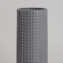 Contemporary grey ceramic vase with grid pattern and clean cylindrical form photographed in soft neutral lighting.