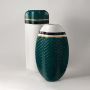 Collection of ceramic vases in teal white and gold displayed together for modern interior decor.