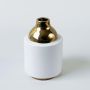 Ceramic vase with glossy white finish and golden neck ideal for home table centerpiece and modern decor styling.