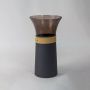 Modern decorative vase with smoked glass top and matte black base featuring beige trim on white background.
