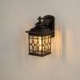 Traditional outdoor lantern shown on a white background highlighting its dark metal frame and patterned glass panels.