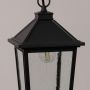 Black outdoor lantern shown in a detailed closeup highlighting the textured glass panels and clean frame design against a clear white background.